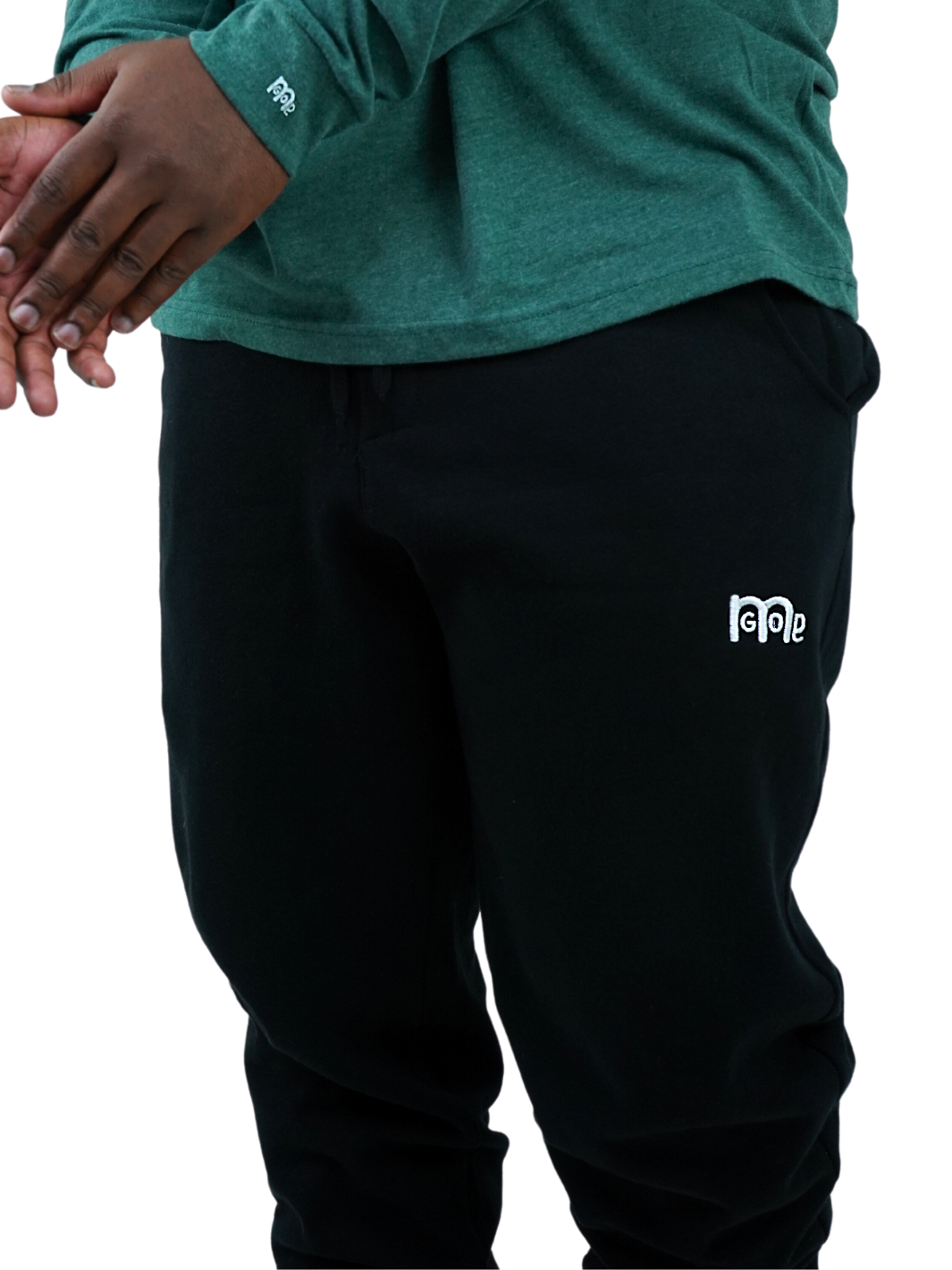 Experience the ultimate comfort in Men's joggers with GODinme! Made with premium quality fabric, these Black GODinme sweat pants offer an elastic waistband for that perfectly relaxed fit. Featuring ribbing ankle cuffs, sewn eyelets, and the signature GODinme logo (in White) at left leg.