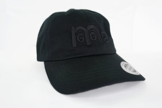 The forever popular Black 6 panel unstructured Dad Hat has Black curved under visor and antique Brass buckle closure. Embroidered in Black is the GODinme Logo on front and GODinme name on left side.