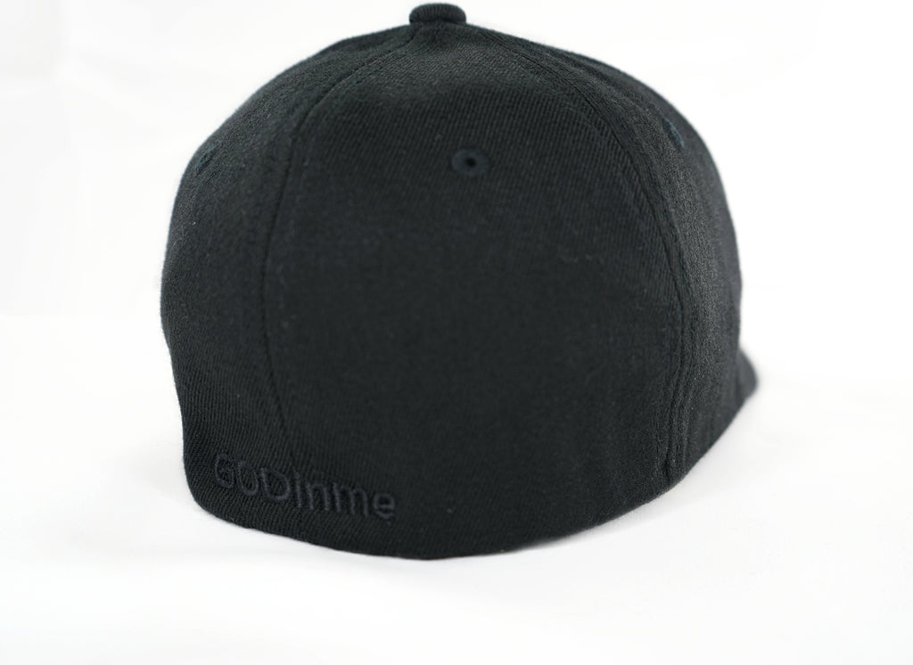 Smooth and sleek Black 6 panel Fitted Hat has curved Silver under visor with puff style GODinme logo embroidered in Black on front and flat style GODinme name embroidered on back.