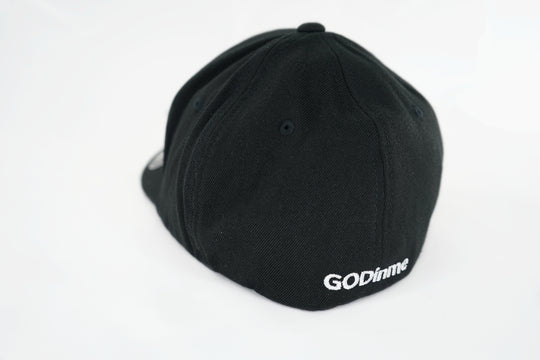 Smooth and sleek Black 6 panel Fitted Hat has curved Silver under visor with puff style GODinme logo embroidered in White on front and flat style GODinme name embroidered on back.