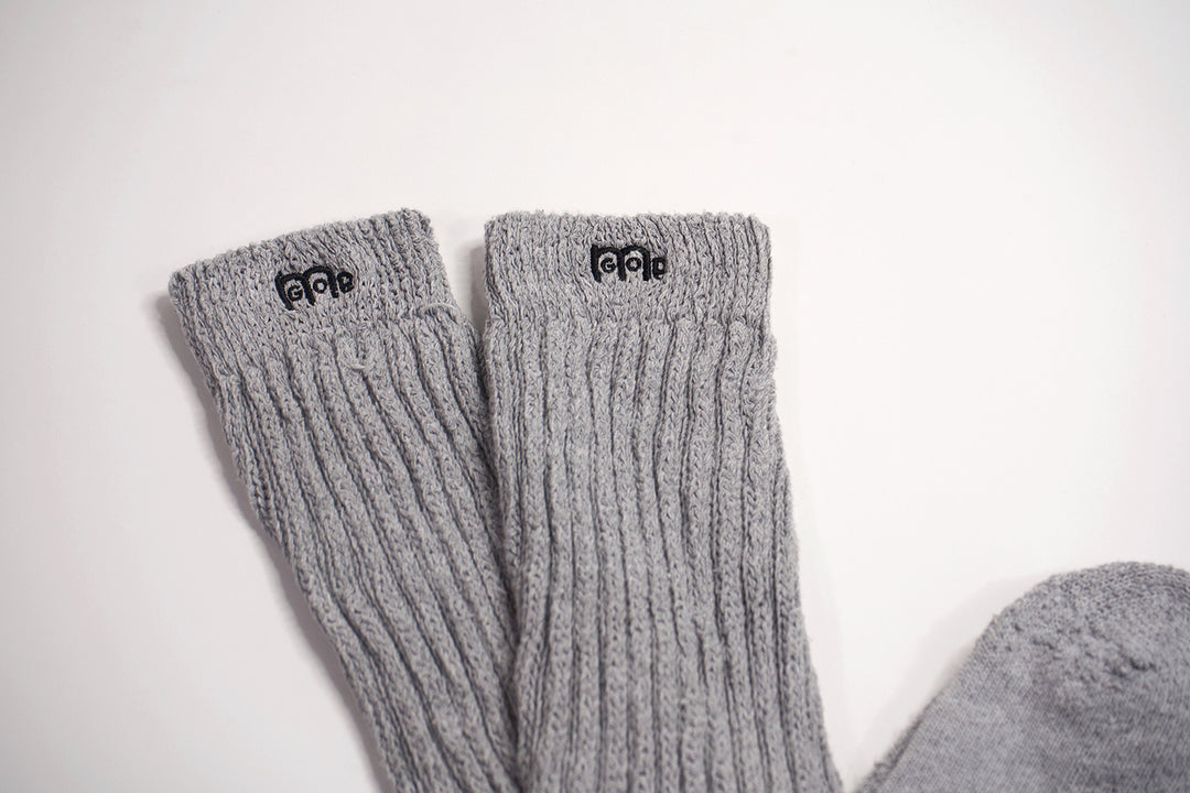Grey slouch socks with Black logo
