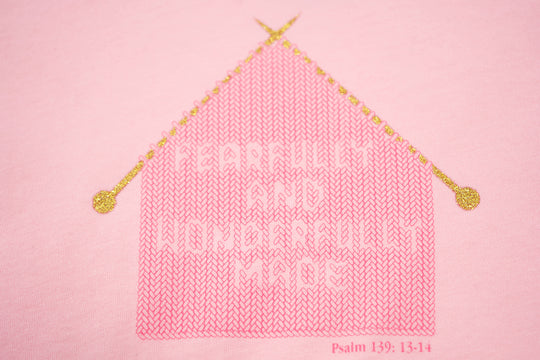 Pink Toddler T-Shirt with "Fearfully and Wonderfully Made" printed on front and woven GODinme logo tag sewn at bottom left