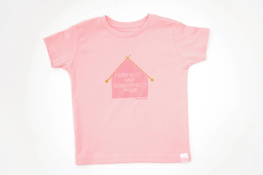 Pink Toddler T-Shirt with "Fearfully and Wonderfully Made" printed on front and woven GODinme logo tag sewn at bottom left